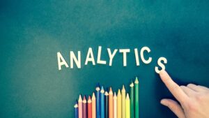 'analytics' written with colour pencil placed underneath