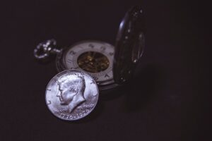 a pocket clog and a coin placed together