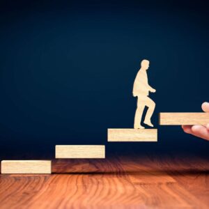 A man walking up the stairs through executive coaching